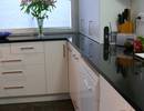Kitchen featuring black granite benchtop